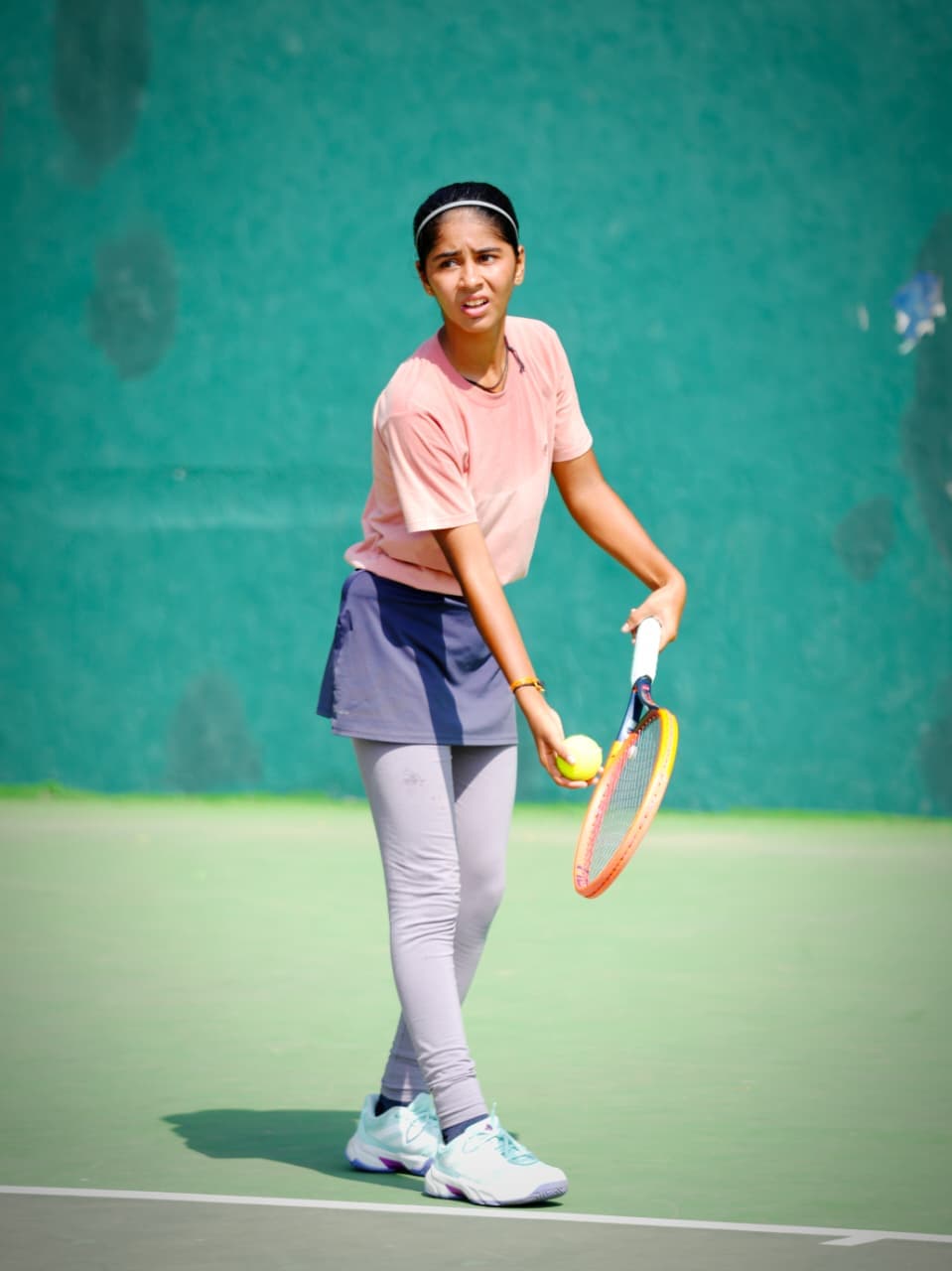 On regular schooldays, Jensi spends at least four hours practising tennis in the evening