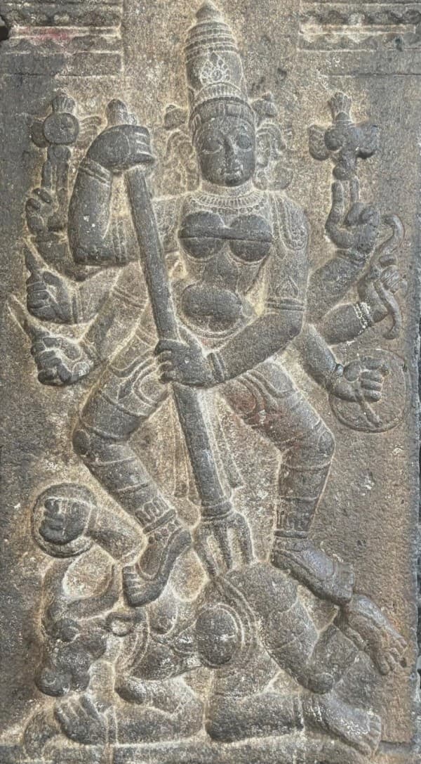 Durga robustly triumphant in a forest-like mandapa of boldly carved pillars at Dhenupureeswarar temple at Madambakka, built 956–973