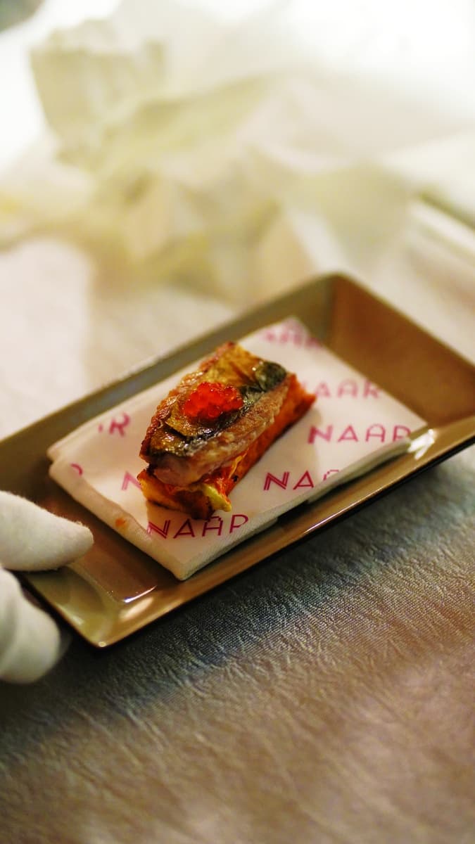 The Dirty Toast, a piece of trout, served on khambir, sharpened with mustard and pickled chilli, and finished with a crisp sheet of its own skin