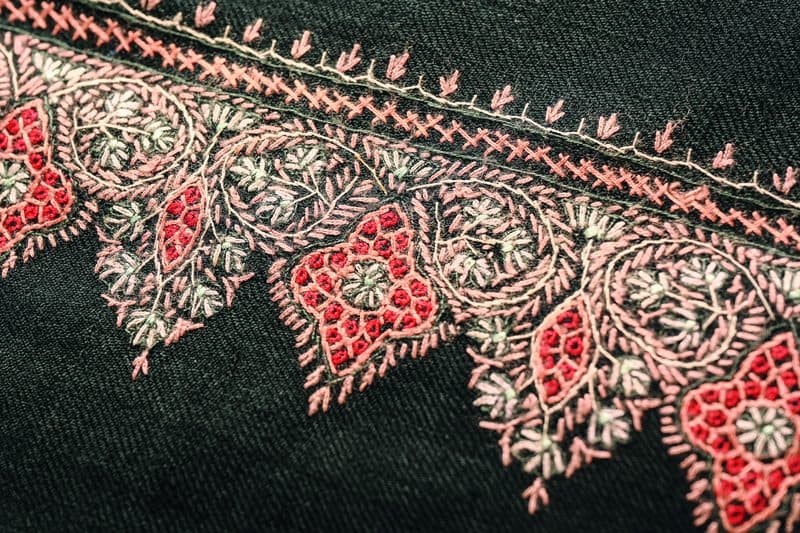 A pashmina with exquisite Sozni work on an uncommon black base