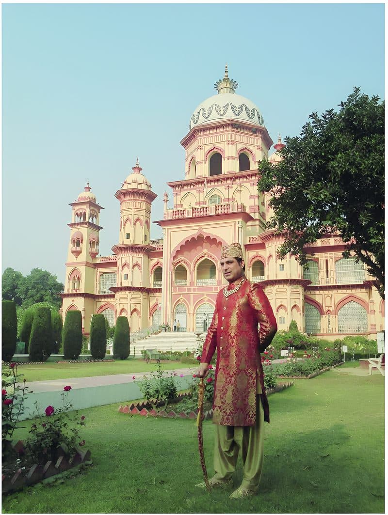 Nawab Kazim in front of Hamid Manzil Palace, built in 1905 by his great-grandfather